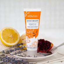 Load image into Gallery viewer, Product image with half a lemon, lavender and pomegranate of Frence Brand, oOlution's Shine Bright skincare mask to brighten up your dull complexion.